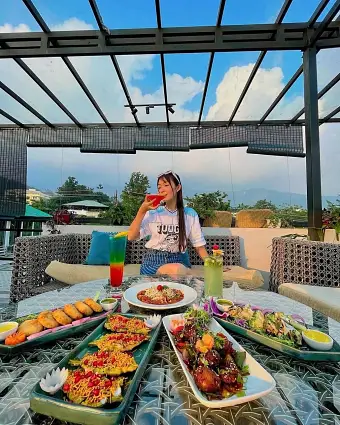 Open-air rooftop bar seating for group birthday party celebrations in Dehradun